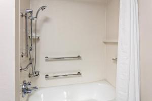 a bathroom with a shower and a sink at Fairfield by Marriott Port Clinton Waterfront in Port Clinton