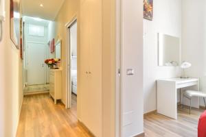 a hallway with a door leading to a room with a bed at Lata Luxury Apartment in Rome