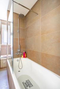 a bathroom with a bath tub and a shower at Modern Twin Room with a balcony in Montijo