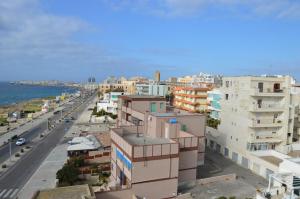 a view of a city with buildings and the ocean at La Stella di Gallipoli in Gallipoli