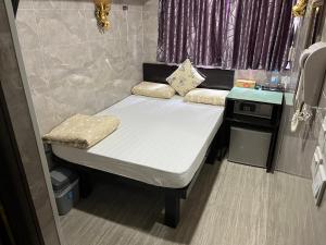 a small bed in the back of an rv at Victoria Inn in Hong Kong