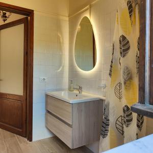 a bathroom with a sink and a mirror at Casale Le Sette Vene in Mercatale +109 photos