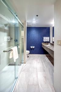 a bathroom with a glass shower and a toilet at Fairfield by Marriott at Lakewood Ranch - Sarasota in Sarasota