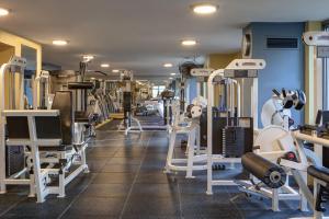 a gym with rows of tread machines and weights at Courtyard by Marriott Chicago Downtown/River North in Chicago