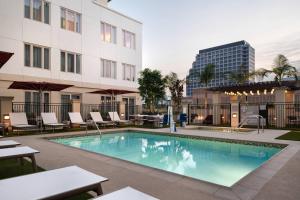 a swimming pool in the courtyard of a building at Residence Inn Los Angeles Glendale in Glendale