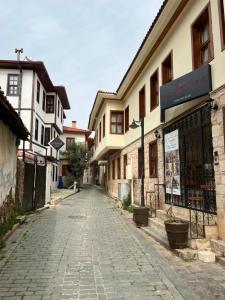 an empty street in a town with buildings at Kaleici Aparts Antalya in Antalya