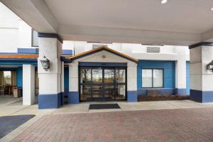 a blue and white building with a glass door at SpringHill Suites by Marriott Pittsburgh Washington in Washington