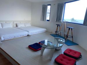 Voodi või voodid majutusasutuse Fuyue Sea View B&B toas