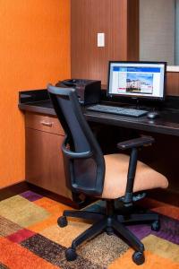 an office with a desk with a computer and a chair at Fairfield Inn & Suites Waco South in Waco