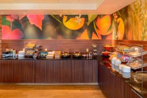 a buffet line in a restaurant with food at Fairfield Inn Joplin in Joplin