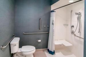a bathroom with a toilet and a shower at Residence Inn by Marriott Rapid City in Rapid City