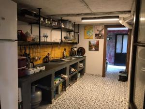 a kitchen with a sink and a counter top at Titan House in İzmir