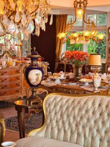 a dining room with a table filled with food at Le Boutique Hotel Gramado - Exclusivo para Casais in Gramado +122 photos