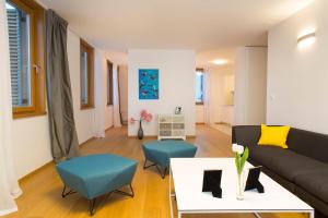 a living room with a couch and a table at Apartment Toni Delux in Split