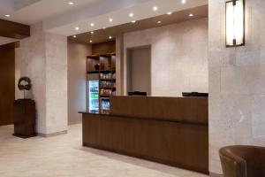 a lobby of a hotel with a reception desk at TownePlace Suites by Marriott Orlando Downtown in Orlando
