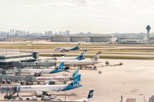 a group of airplanes parked at an airport at Sheraton Gateway Hotel in Toronto International Airport in Mississauga