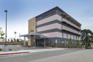 a rendering of a building with a parking lot at Fairfield Inn & Suites by Marriott Santa Cruz in Santa Cruz
