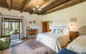 a bedroom with a bed and a couch and a window at Villa Arzilla in Vitorchiano