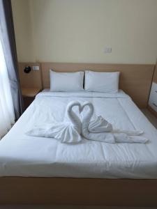 Ένα ή περισσότερα κρεβάτια σε δωμάτιο στο Wellness World Khao Yai