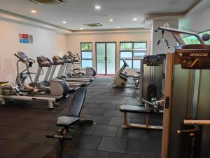 a gym with a bunch of treadmills and machines at 703 KLCC 5 minutes to Alor Street Ceylon Pavilion 3 Room Apt for 10 Pax in Kuala Lumpur