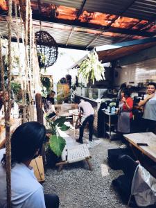 a group of people working in a shop with aorer working at Hostal Hoja Santa in Cholula