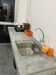 a kitchen counter with a stainless steel sink at SmileHome at Cameron Palas Horizon - KEA FARM in Brinchang