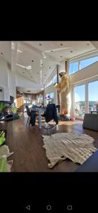 a living room with a bear standing in a room at Haus mit schöner Aussicht WG in Münsingen