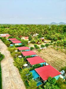 an overhead view of a row of houses with red roofs at Damnak Borey Resort in Kampot