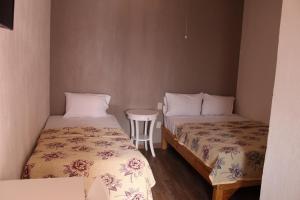 Krevet ili kreveti u jedinici u okviru objekta Hotel el Rinconcito Yuriria Gto