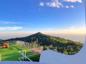 a view of a playground with a mountain in the background at ภูนางฟ้า Angel Hill in Ban Khlong Phai