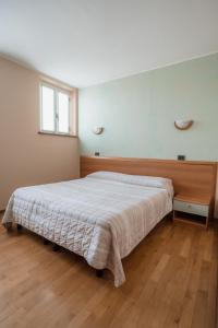 Posteľ alebo postele v izbe v ubytovaní Agriturismo San Francesco