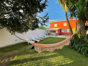 a hammock in the yard of a house at Fonte do Forno Villas in Afife