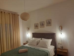 Postel nebo postele na pokoji v ubytování Giotouli Apartment
