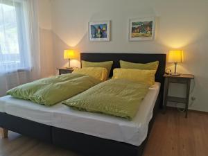 Postel nebo postele na pokoji v ubytování Ferienwohnung Vogelsang im Schwarzwald