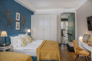 Posteľ alebo postele v izbe v ubytovaní B&P Maine Street Apartments