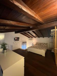 a bedroom with a bed in a room with wooden ceilings at Residenza Morlupo (Fleming) in Rome