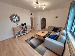 a living room with a couch and a table at Ferienhaus in der Wachau in Rossatzbach