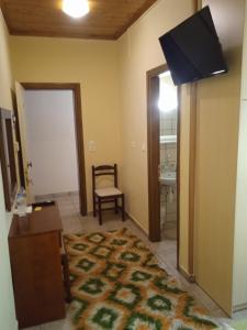 TV a/nebo společenská místnost v ubytování Thiamis Guesthouse