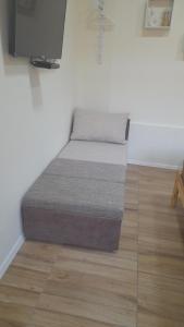Posteľ alebo postele v izbe v ubytovaní Magnolia apartman