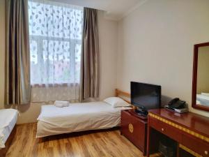Posteľ alebo postele v izbe v ubytovaní Milky Way Hotel