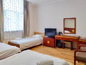 Posteľ alebo postele v izbe v ubytovaní Milky Way Hotel