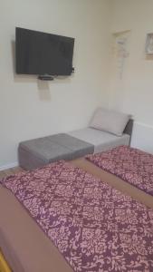 Posteľ alebo postele v izbe v ubytovaní Magnolia apartman