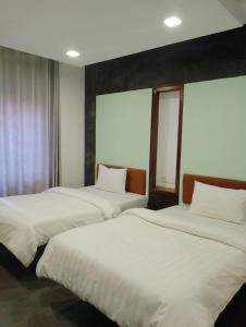 Postel nebo postele na pokoji v ubytování Shalima Guesthouse