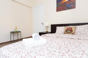 a bedroom with a bed with a hello kitty comforter at Aladdin's Hostel in Larnaka