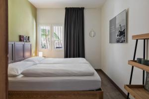 A bed or beds in a room at Casa Alicante - Relax in a unique environment