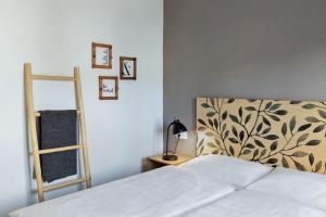 A bed or beds in a room at Casa Alicante - Relax in a unique environment