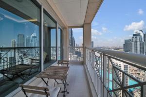 a balcony with benches and a view of the city at 29Blvd BurjView in Dubai