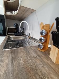 a kitchen with a sink and a counter top at DREAMS APARTMENT KAŠTELA in Kaštela +12 photos