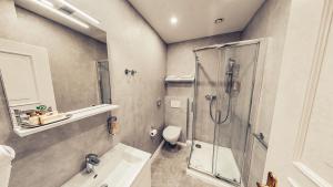 Kúpeľňa v ubytovaní Alfons Boutique Hotel