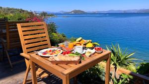 a table with a tray of food on top of the water at Sofia Ada in Fethiye